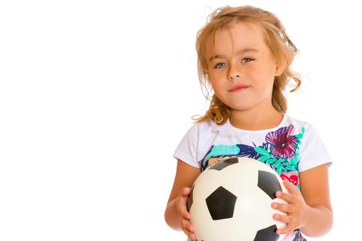 Little girl with a soccer ball.