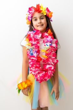 Cute girl in Hawaiian style clothes on white background