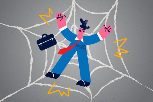Unhappy businessman trapped in spider web network