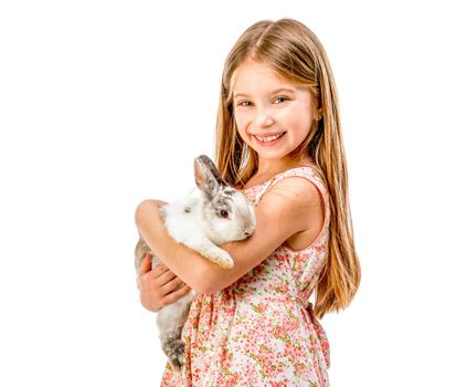cute little girl a white rabbit