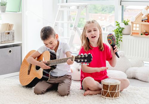 Cute children playing musical instruments
