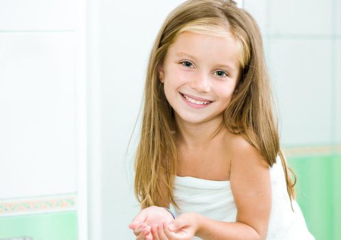 Cute little girl washing