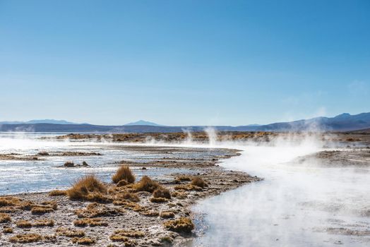 Sunshine surface covered with steam and geysers in Bolivia