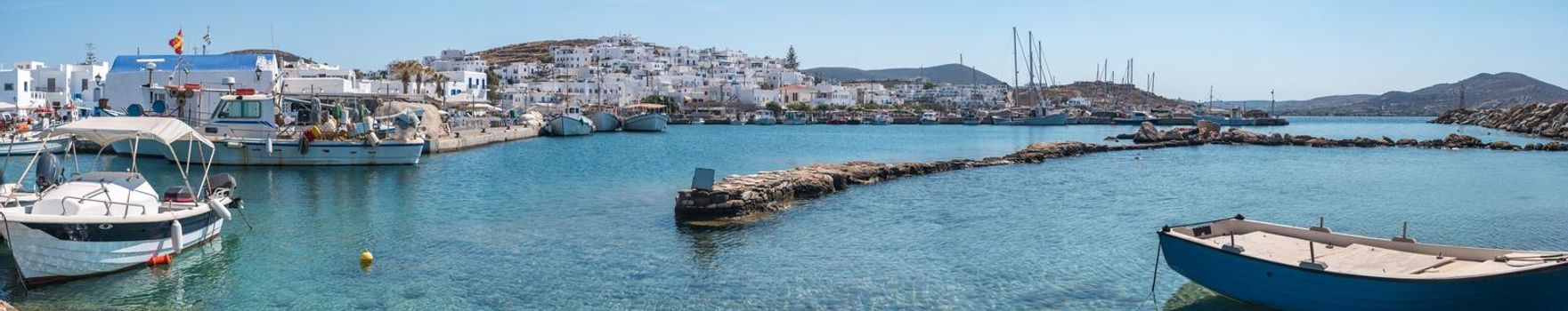 Boats moored in Mykonos harbor panorama view