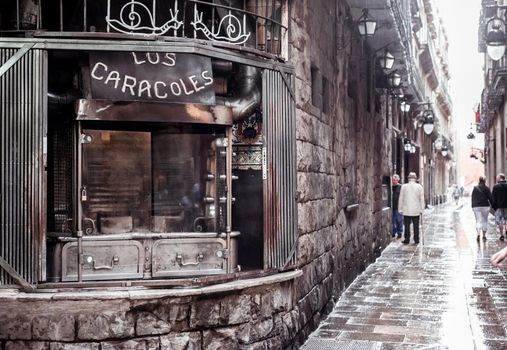 old snails take away shop at the corner of the ancient streets in gothic quarter