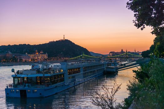 big touristic steamboat on Danube at sunset
