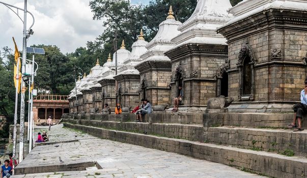Wall with white small temples around Pashupatinath temple. Kathmandu, Nepal, Asia.