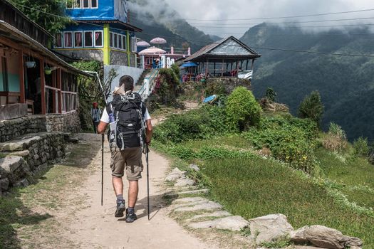 Tourist hikes on Annapurna trekking trail.