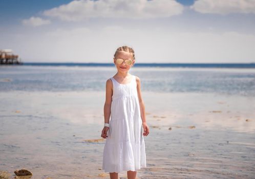 Girl standing at seashore