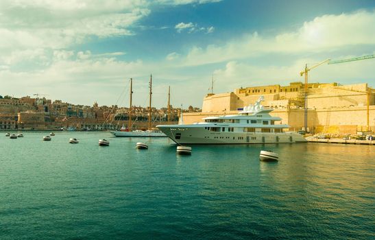 colorful landscape with yachts in Valletta bay