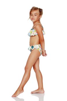 Tanned little girl in a swimsuit