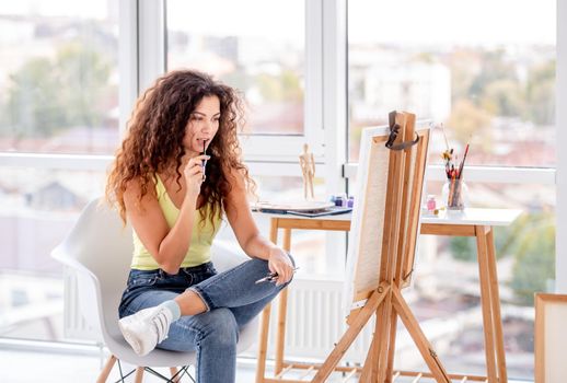 Girl painter making new picture