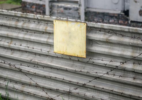 empty signboard on fence with wire in Chernobyl