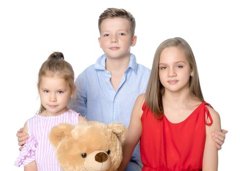 Brother and two sisters with a teddy bear
