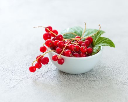 rustic bowl full of red currant berries