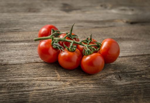 Red ripe tomatoes connected to each other