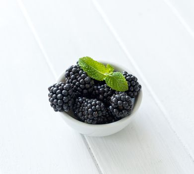Blackberry on a wooden background