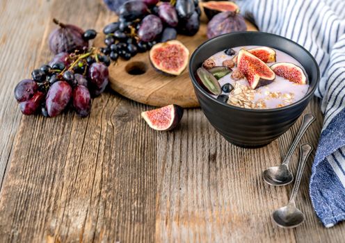 An useful dessert - yogurt, muesli and figs with grapes