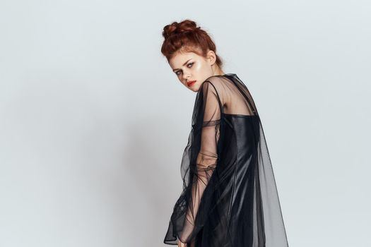 woman with black veil dress posing elegant style