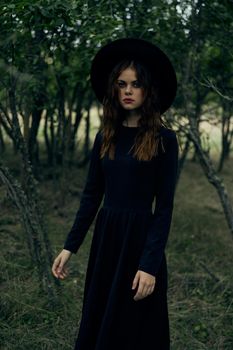 witch in the woods posing costume halloween gothic style