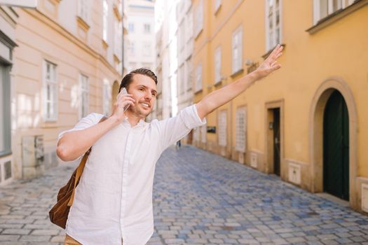 Young man background the old european city take selfie