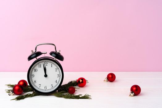 Christmas and New Year countdown concept with alarm clock