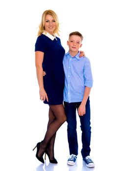 Beautiful young mother with her teen son in the studio.