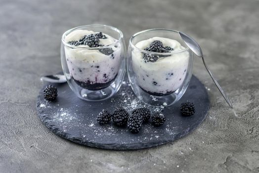 Dessert from yogurt with blackberries