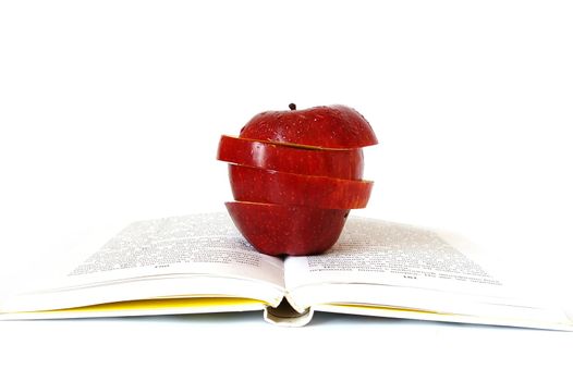 Pieces of apple on the book