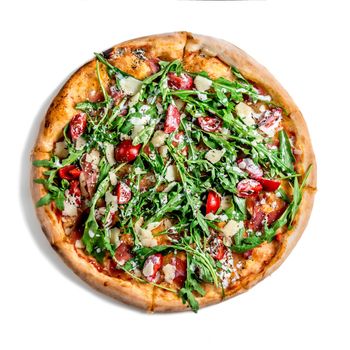 Pizza with dry cured ham and arugula