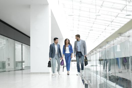 visitors walk in the lobby of the business center