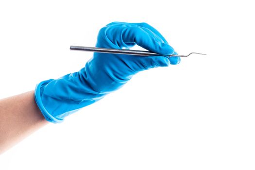 Hand in blue glove holding dental metal stick isolated