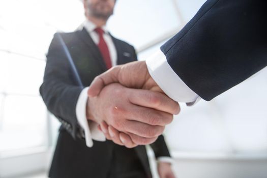 business background.confident handshake of business people