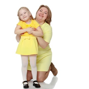 Mom and little daughter plus the size of the model, gently embra
