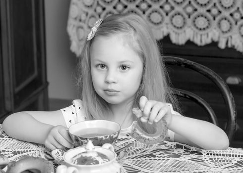 Little girl eating a bagel