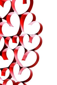 Linked red ribbon hearts on white