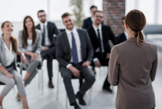 business woman holds a briefing for employees