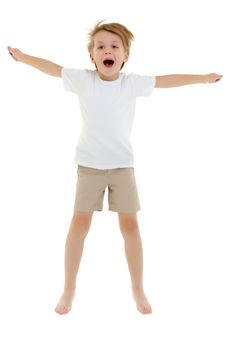 A little boy in a clean white T-shirt is jumping fun.