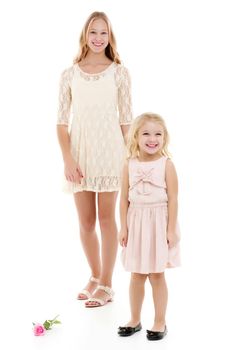 two girls of different ages in the studio on a white background.