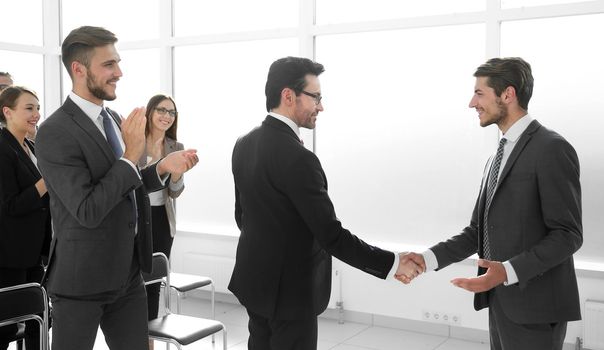 handshake after the completion of a new project plan