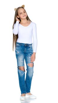 Beautiful teen girl in jeans with holes.