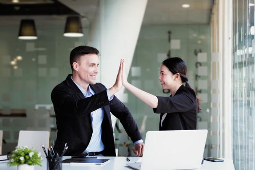 Business Success concept with partner, Partnership Giving Fist Bump after Complete a deal. Successful Teamwork, Businessman with Team Agreement in Corporate.