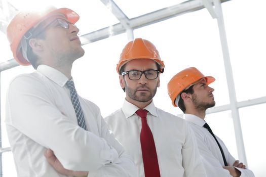 background image of a group of business people in protective helmets