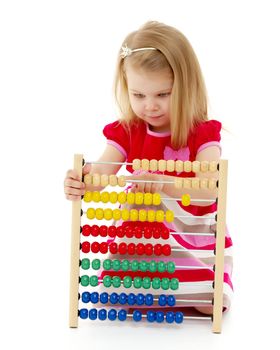 The girl counts on abacus