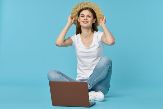 woman sitting on the floor with laptop student education online. High quality photo