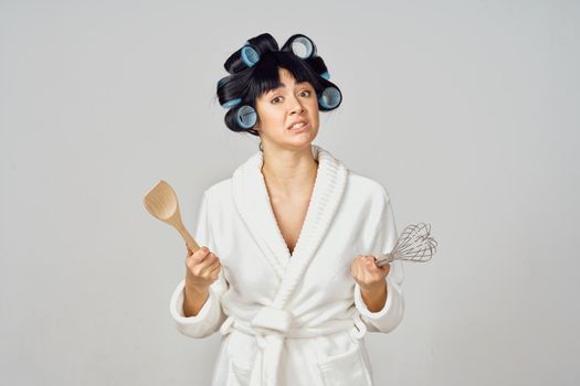 housewife in white robe kitchenware isolated background