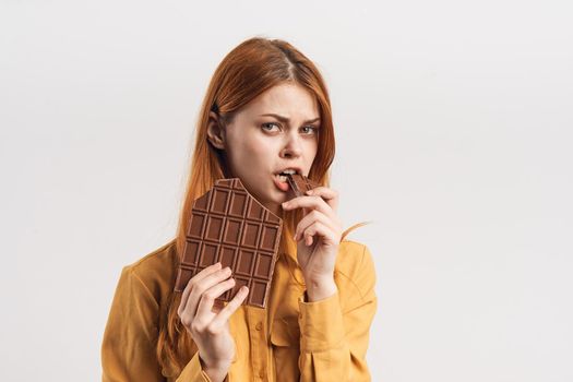 cheerful woman with chocolate bar sweets pleasure