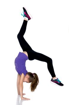 The gymnast performs a handstand with bent legs.