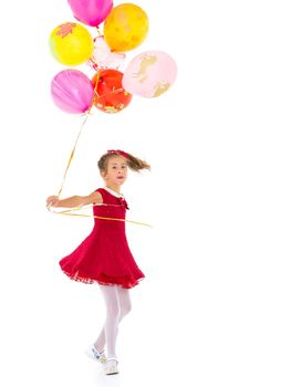 Little girl with helium balloons.