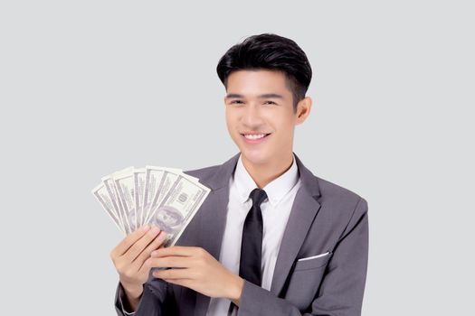 Young asian business man holding money dollar isolated on white background, businessman in suit holding banknote and success and excited with finance, savings and investment, income and spending.